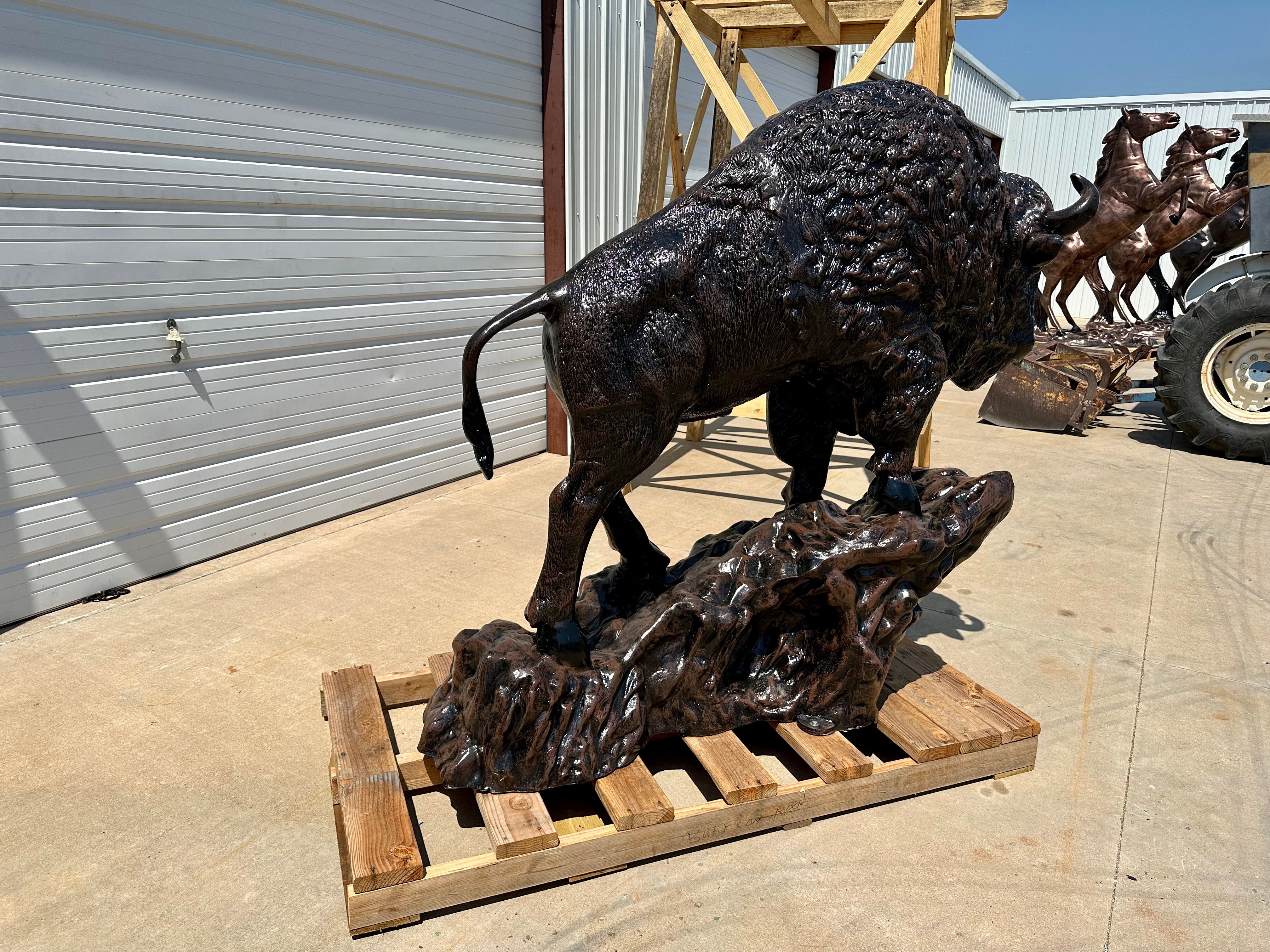 Sold *Medium Buffalo on Rock Statue